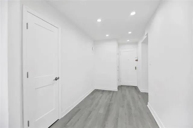 a view of a room with wooden floor and closet