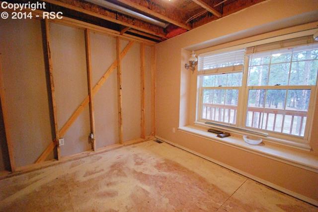 9575 Hardin Road Colorado Springs, CO 80908 - Photo 6 of 24 To the right of the entry is the formal dining area/office. There is plenty of light through to the front-facing windows. Carpeting, insulation, drywall etc, will be installed.