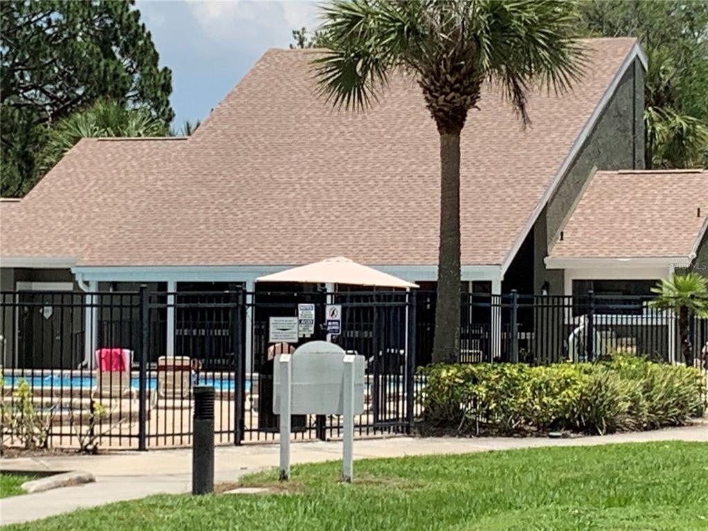 6073 Windhover Drive, Unit C04 Orlando, FL 32819 - Photo 19 of 22 a view of a house with backyard and porch