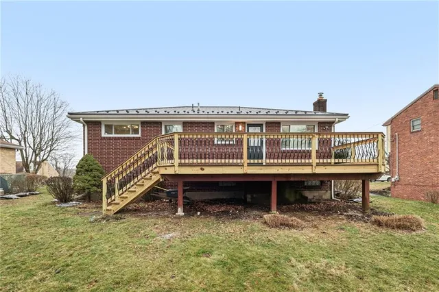 a roof view of a house with a yard and balcony