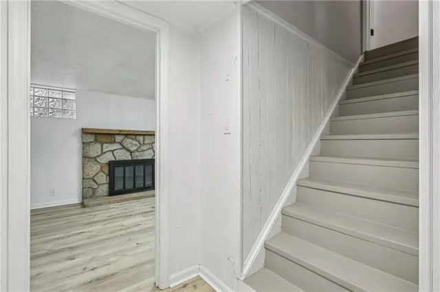 a view of an entryway with wooden floor