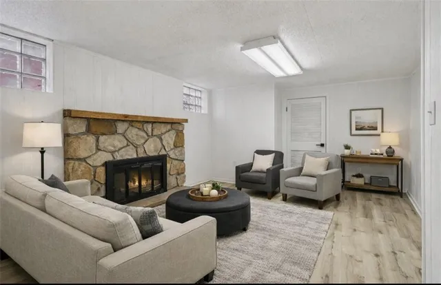 a living room with furniture and a fireplace