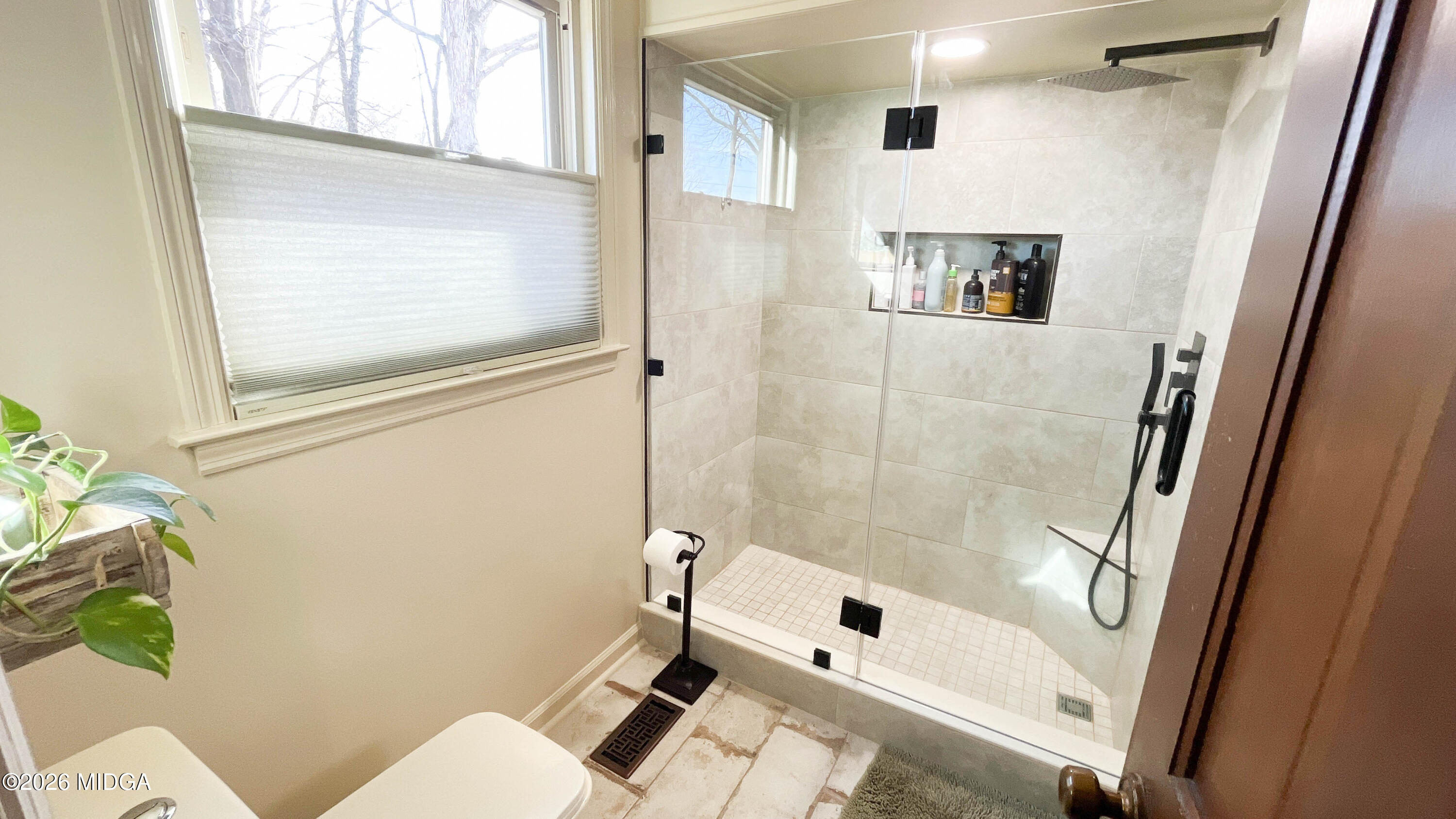 523 Fredonia Church Road Barnesville, GA 30204 - Photo 49 of 78 a bathroom with a shower a toilet and a sink