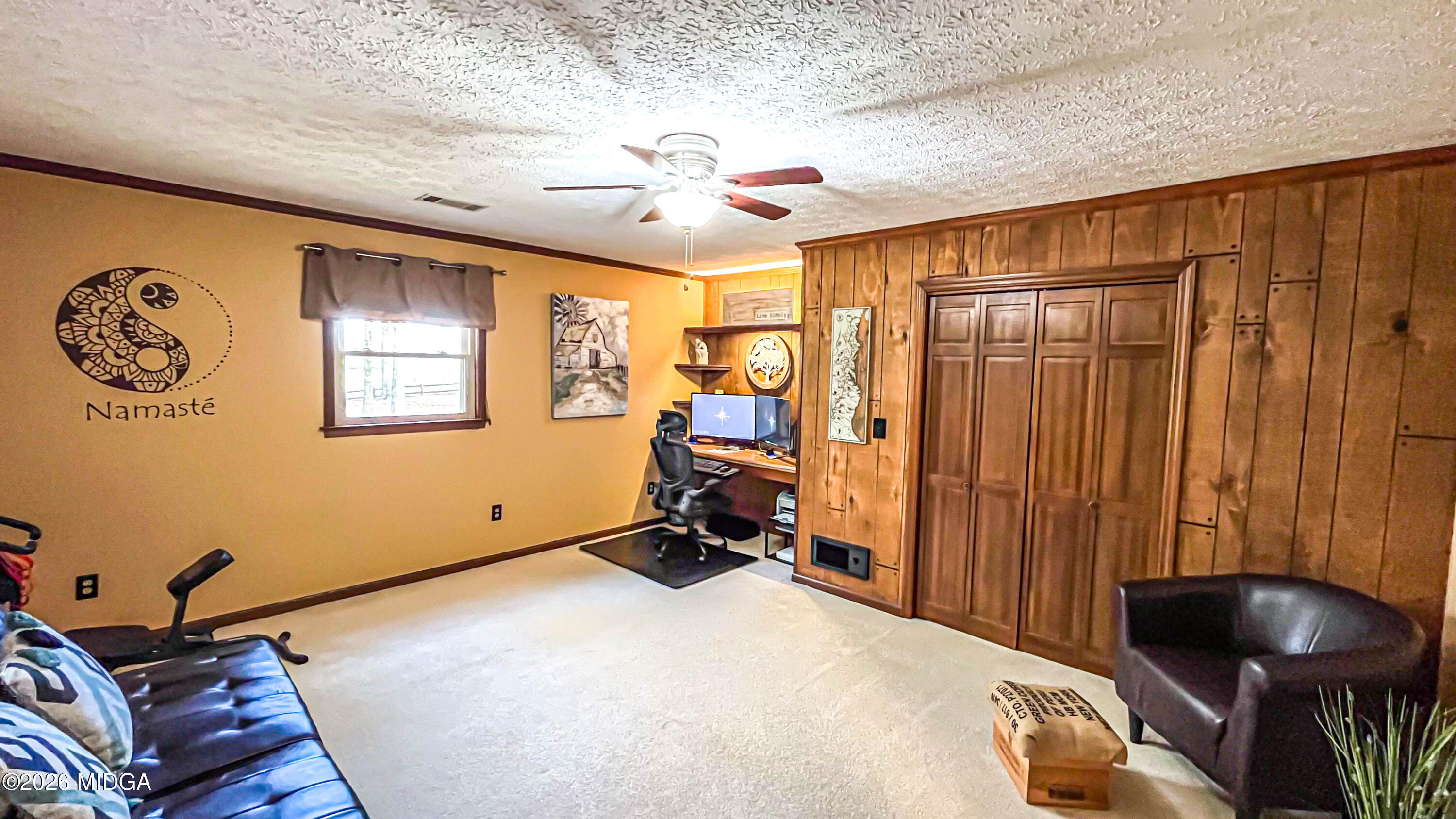 523 Fredonia Church Road Barnesville, GA 30204 - Photo 57 of 78 a bedroom with a bed and a chandelier