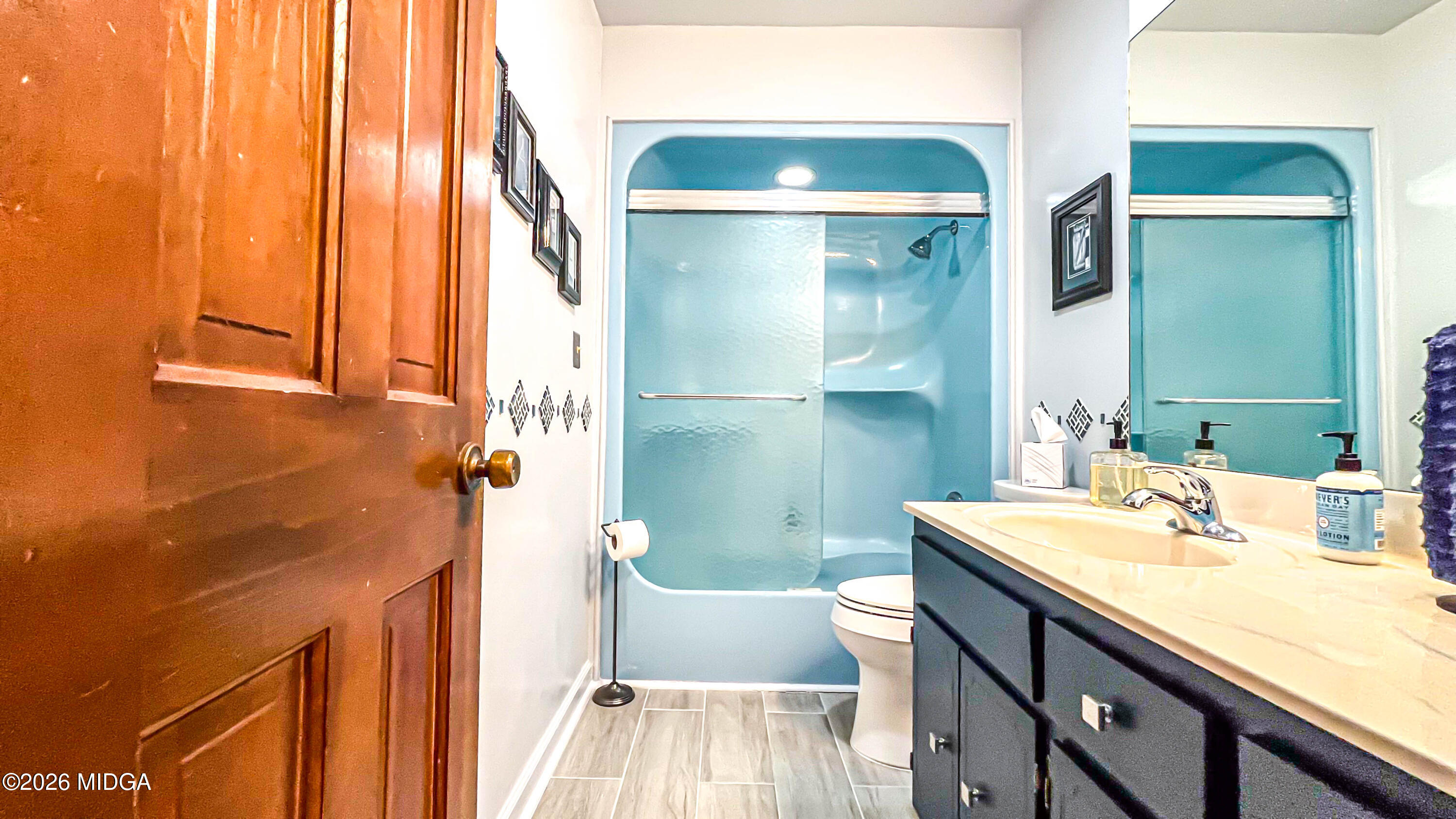 523 Fredonia Church Road Barnesville, GA 30204 - Photo 60 of 78 a bathroom with a sink a toilet and a shower
