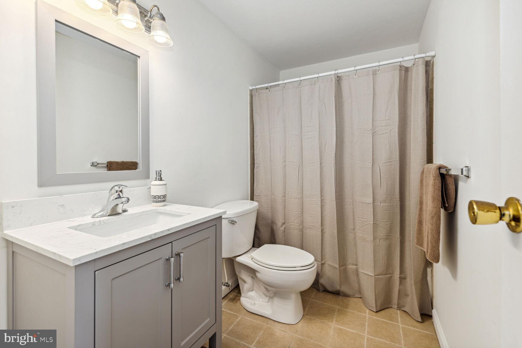 757 Young Way Westminster, MD 21158 - Photo 15 of 30 Full bathroom with tile flooring and new vanity se