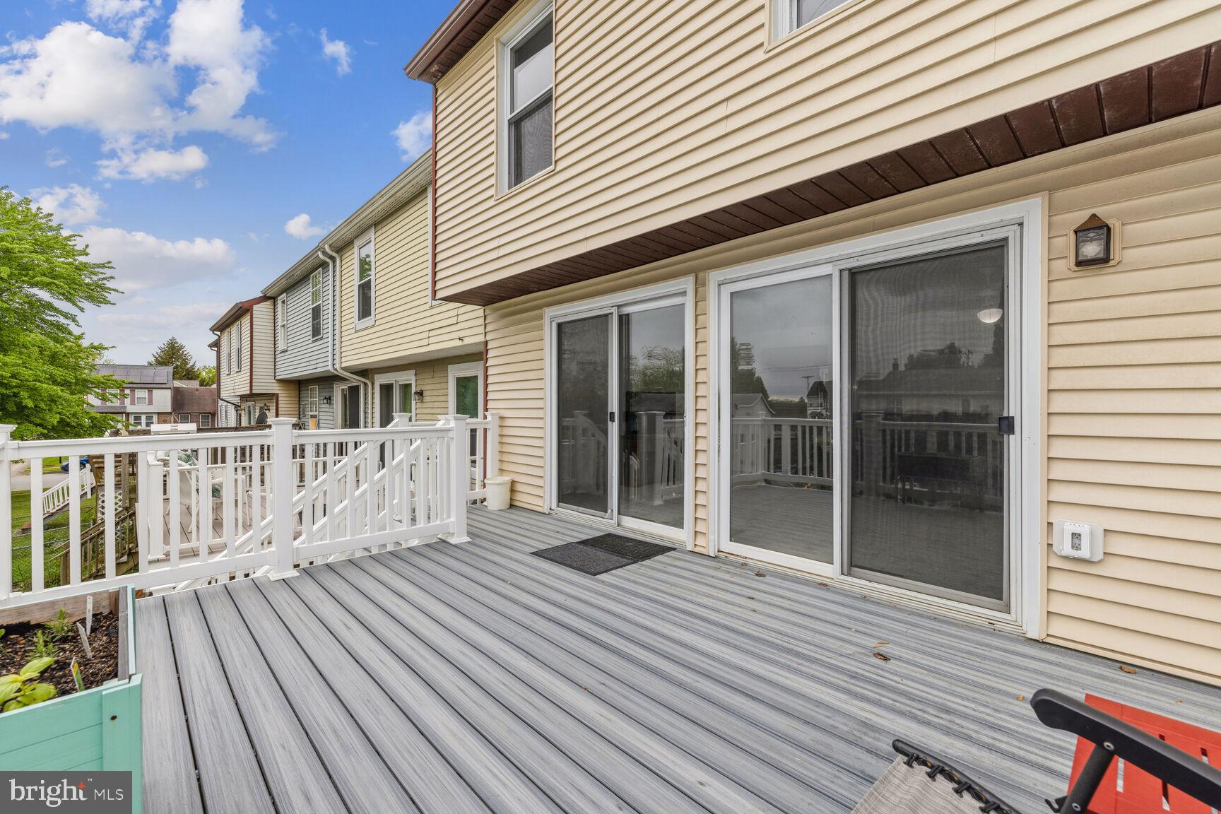 757 Young Way Westminster, MD 21158 - Photo 18 of 30 Two sliders leading to deck.