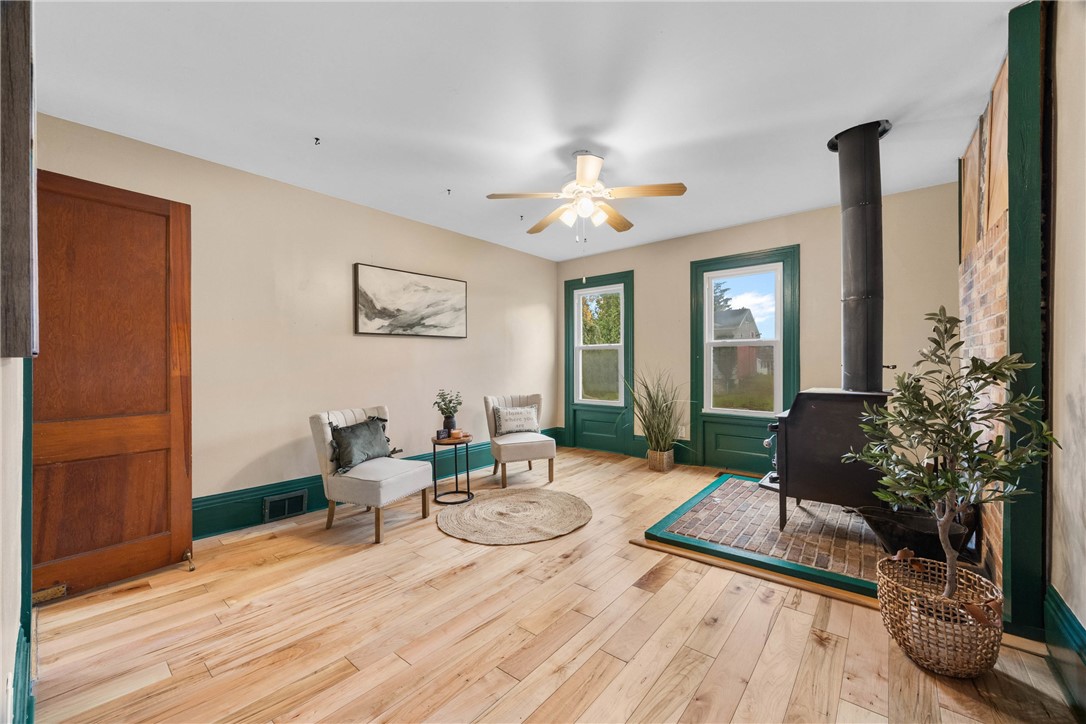 5750 East Henrietta Road Rush, NY 14543 - Photo 17 of 49 Sitting Room with Wood Stove