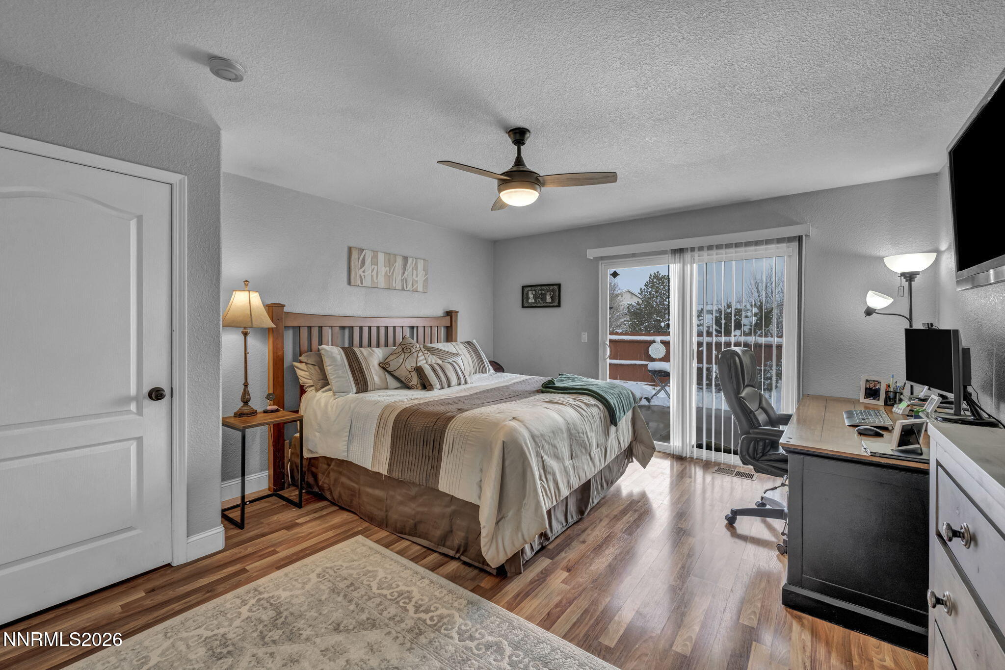 18270 Cedar View Court Reno, NV 89508 - Photo 16 of 48 a spacious bedroom with a bed and wooden floor
