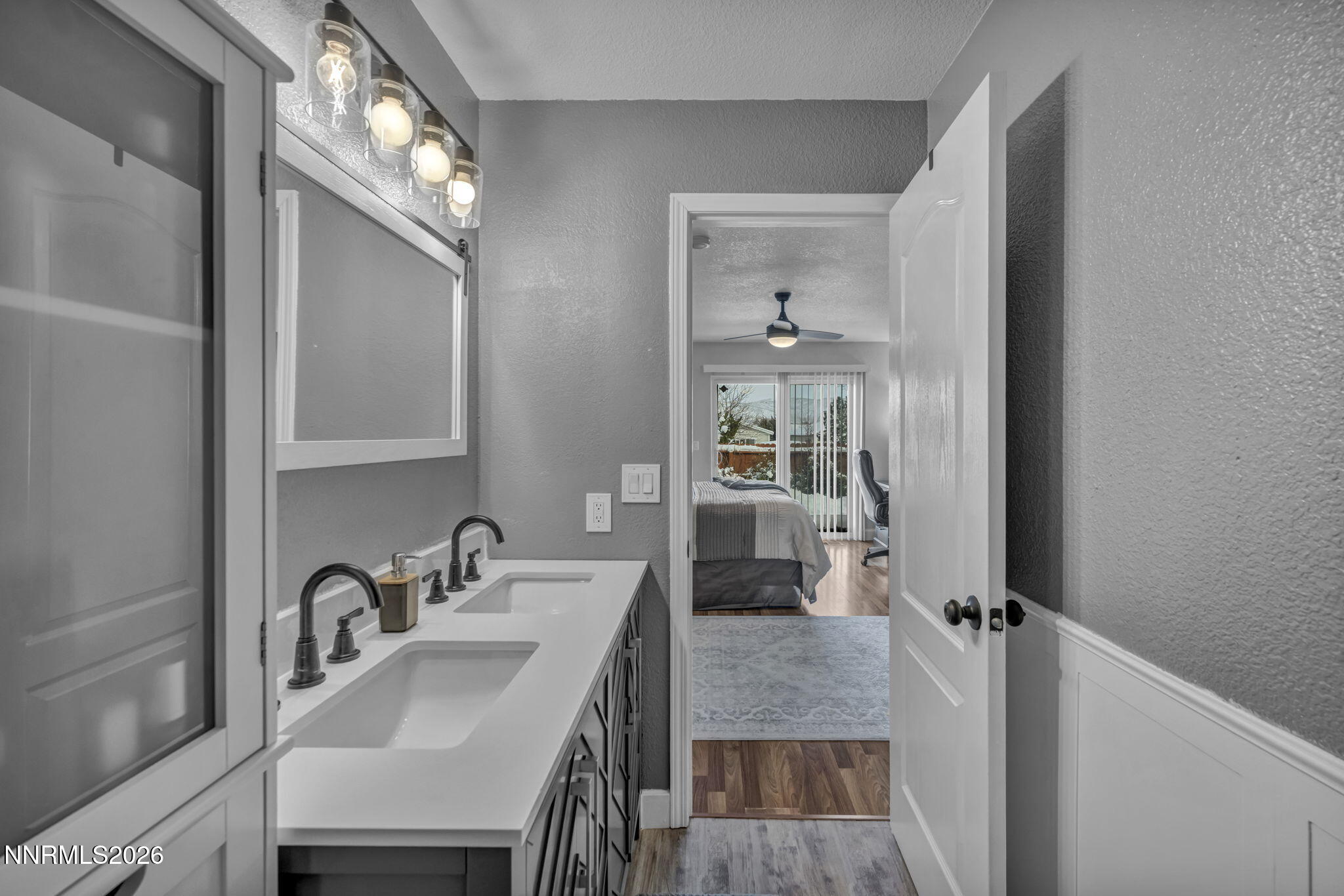 18270 Cedar View Court Reno, NV 89508 - Photo 21 of 48 a en suite bathroom with a sink a mirror and a shower