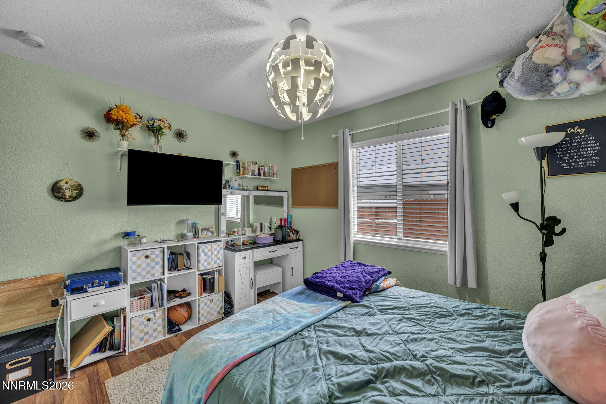 18270 Cedar View Court Reno, NV 89508 - Photo 28 of 48 a bedroom with a bed and a flat screen tv