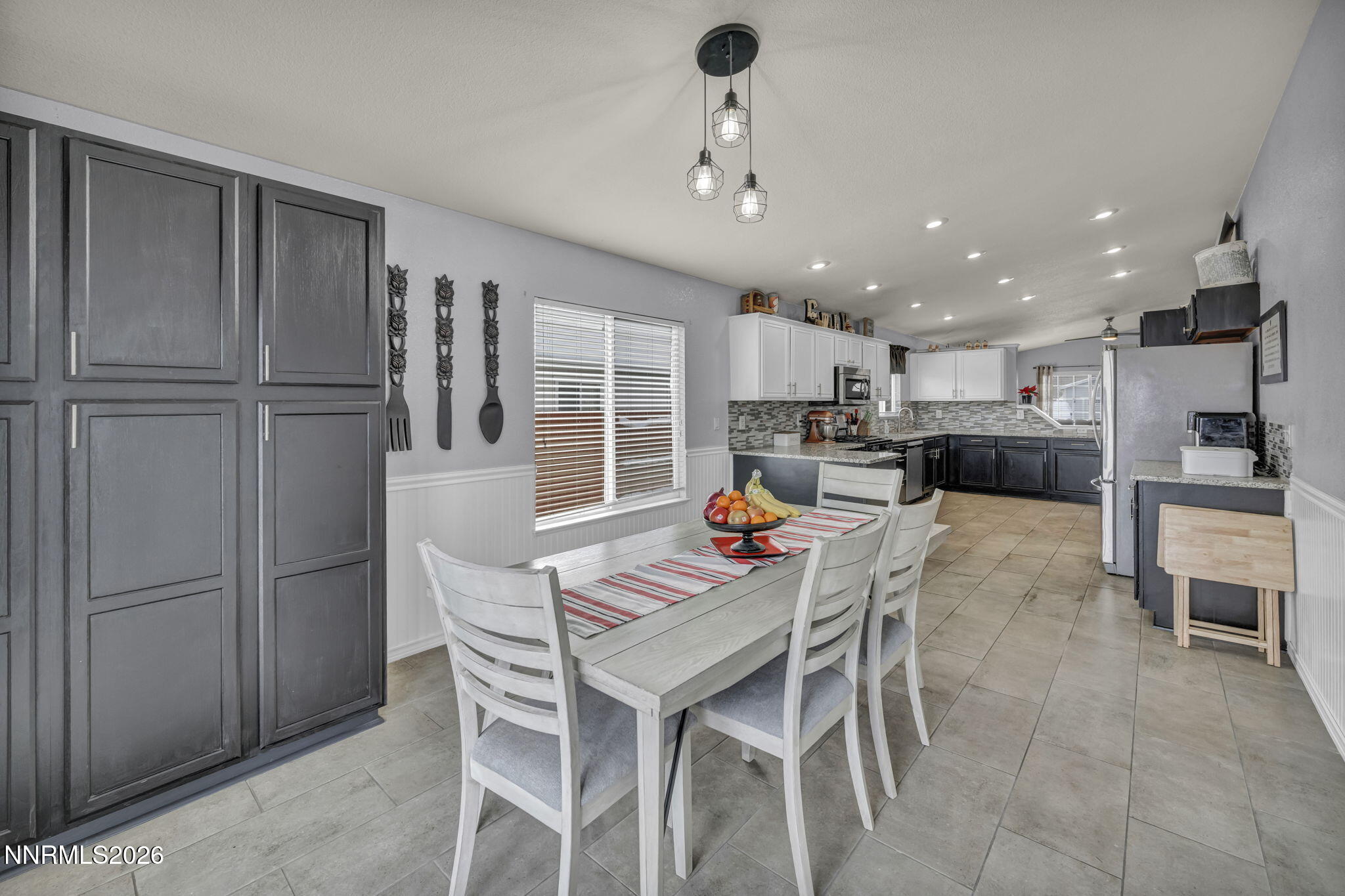 18270 Cedar View Court Reno, NV 89508 - Photo 8 of 48 a kitchen with a refrigerator and a dining table