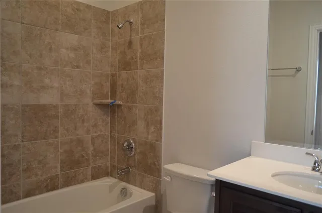 a bath tub sitting next to a white sink