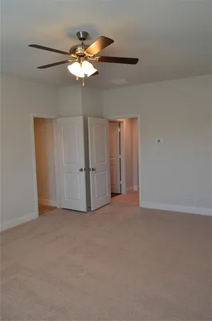 a view of a livingroom with a chandelier fan