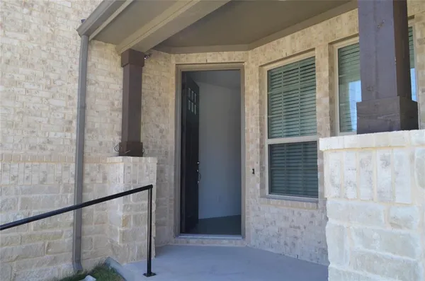 a view of balcony with wooden floor