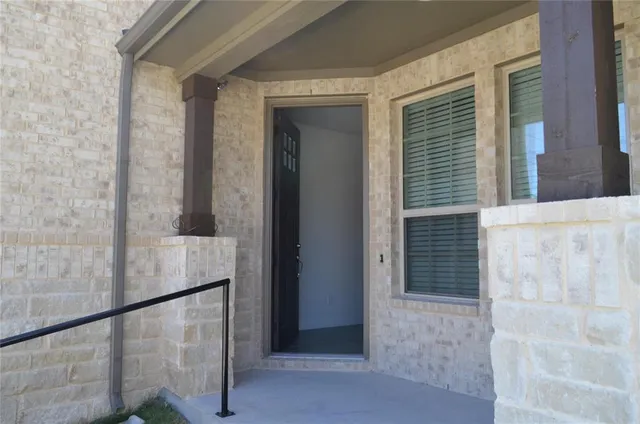 a view of balcony with wooden floor