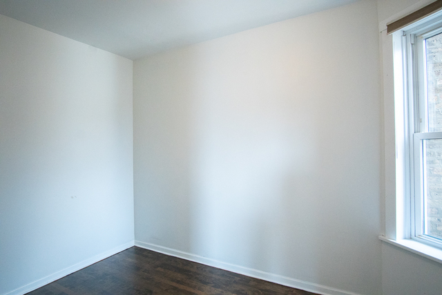 2519 North Pulaski Road Chicago, IL 60639 - Photo 22 of 36 a view of a small space with wooden floor and a window