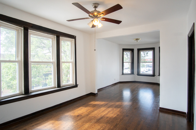 2519 North Pulaski Road Chicago, IL 60639 - Photo 8 of 36 a view of livingroom with hardwood floor and window