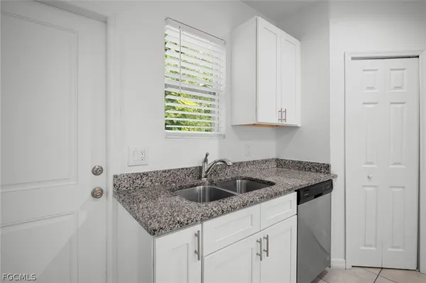 a kitchen with a sink and cabinets
