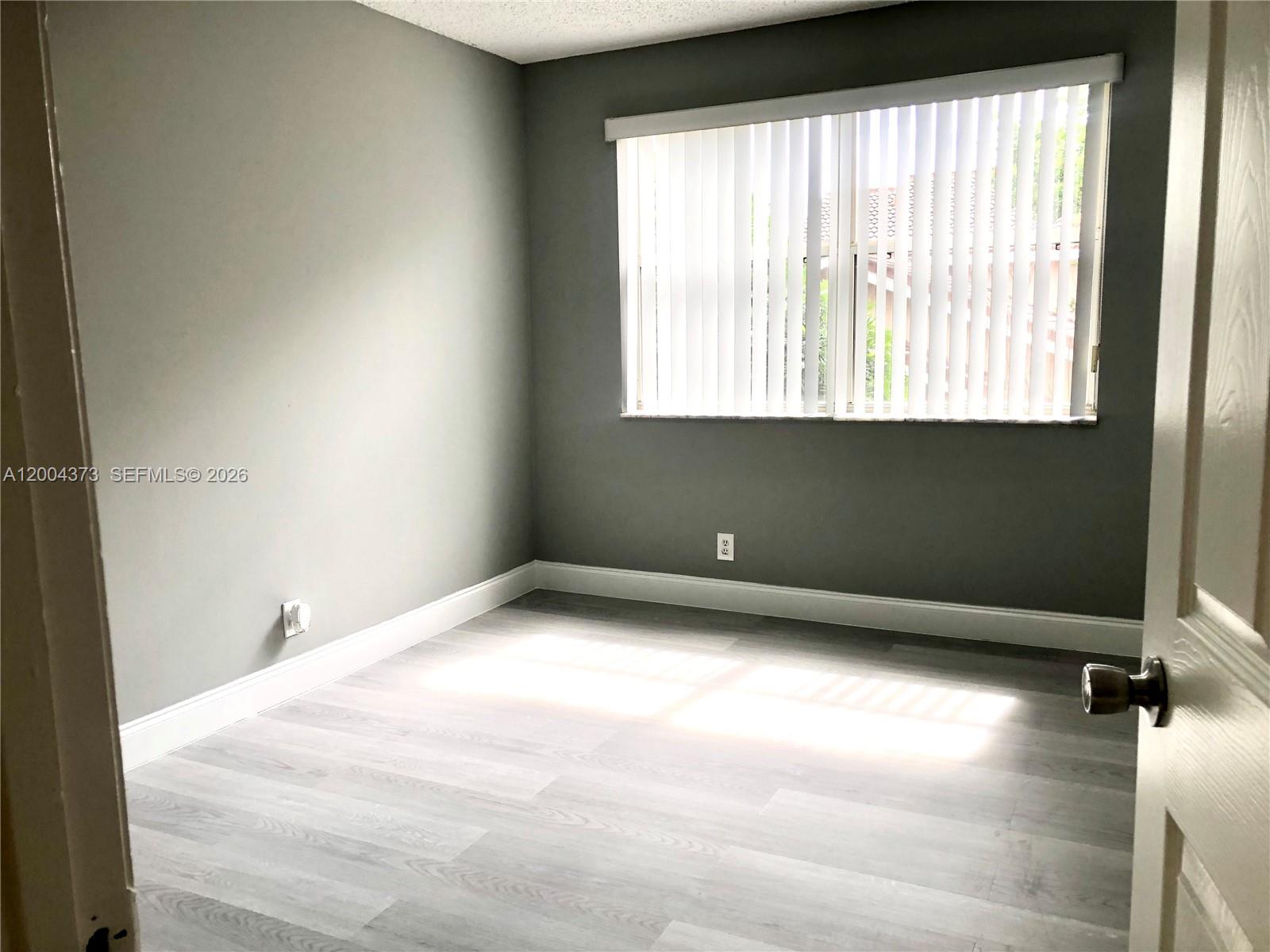 8761 Wiles Road, Unit 306 Coral Springs, FL 33067 - Photo 15 of 19 a view of a room with a window