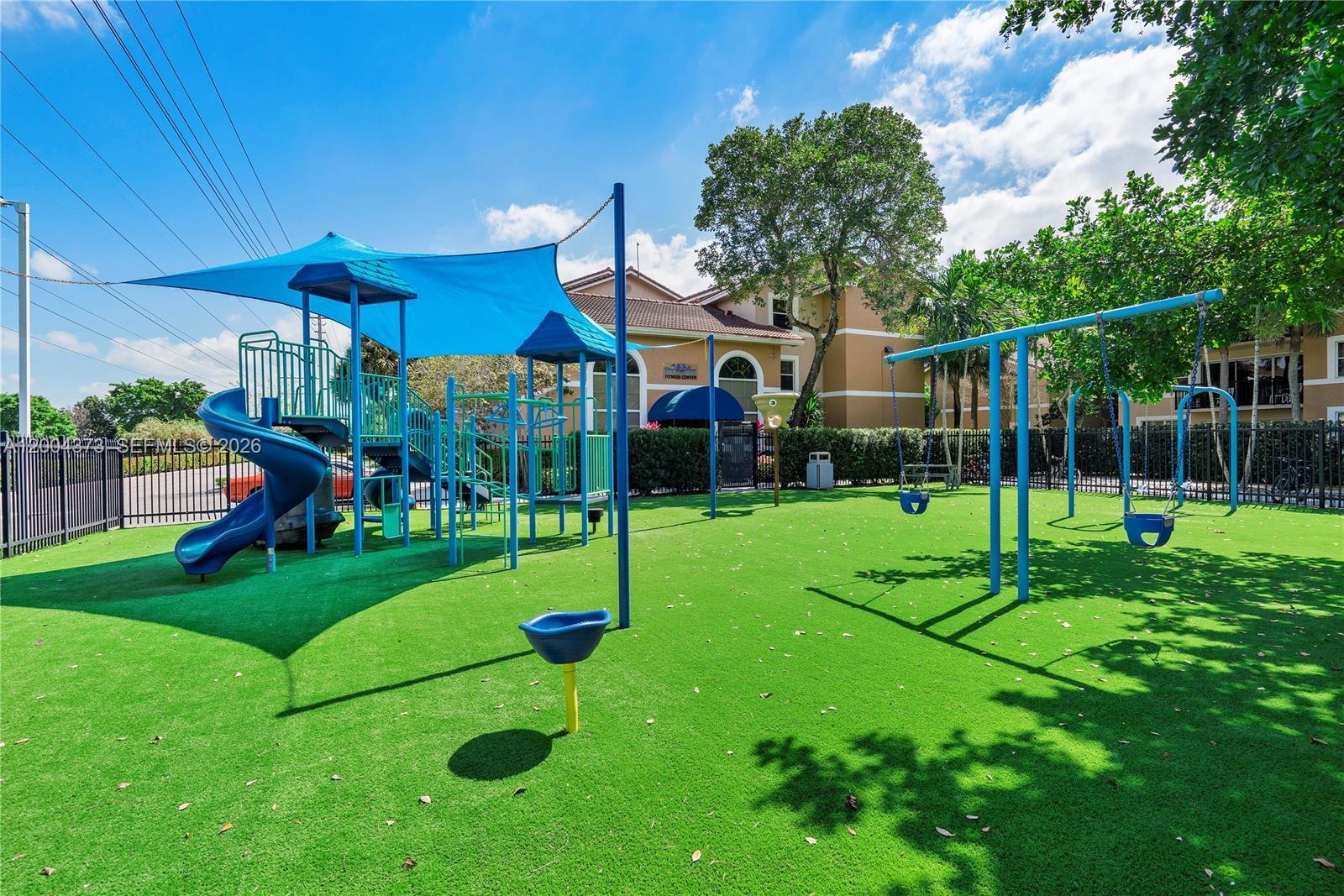 8761 Wiles Road, Unit 306 Coral Springs, FL 33067 - Photo 8 of 19 a view of a house with backyard and sitting area
