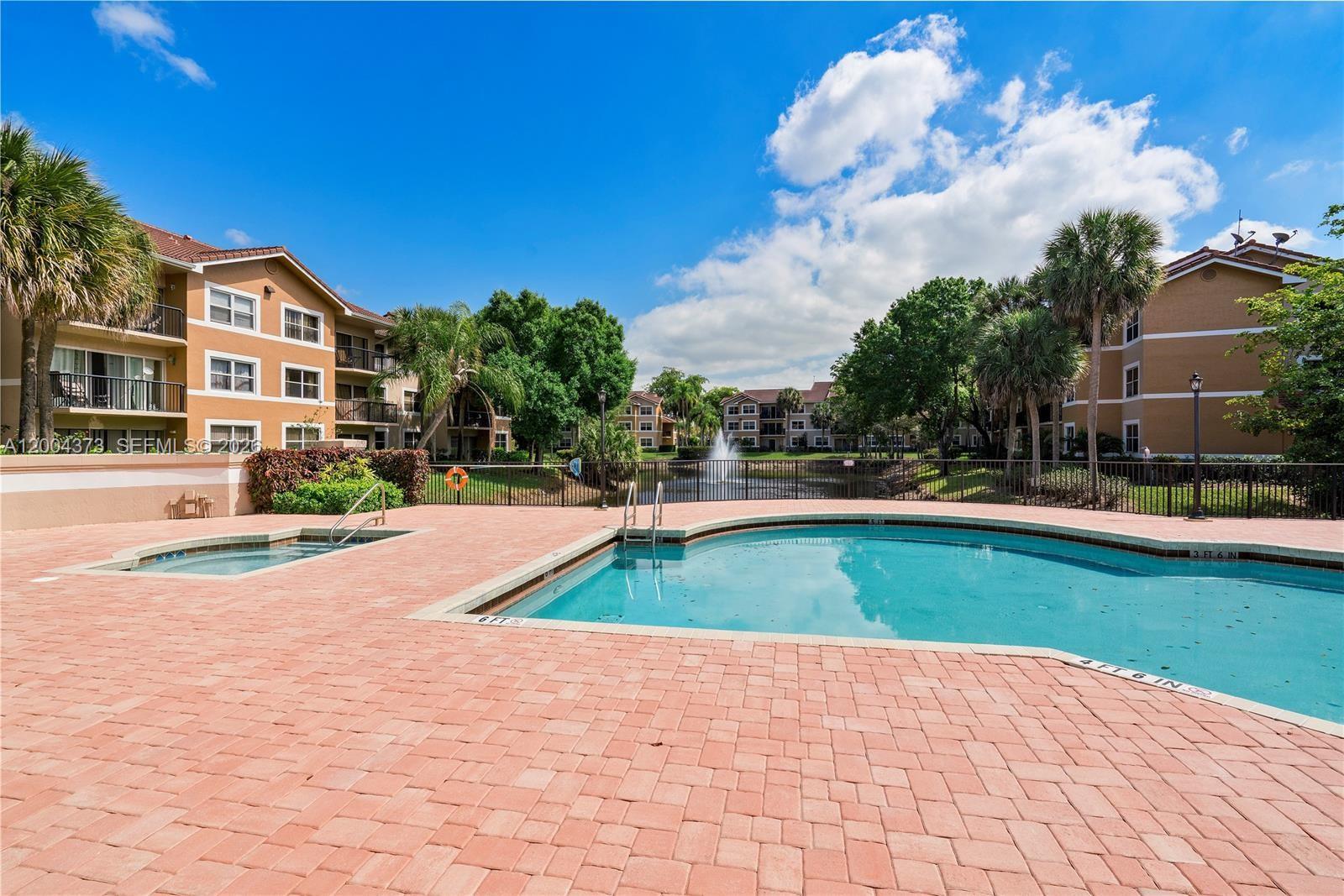 8761 Wiles Road, Unit 306 Coral Springs, FL 33067 - Photo 9 of 19 a view of outdoor space yard and swimming pool