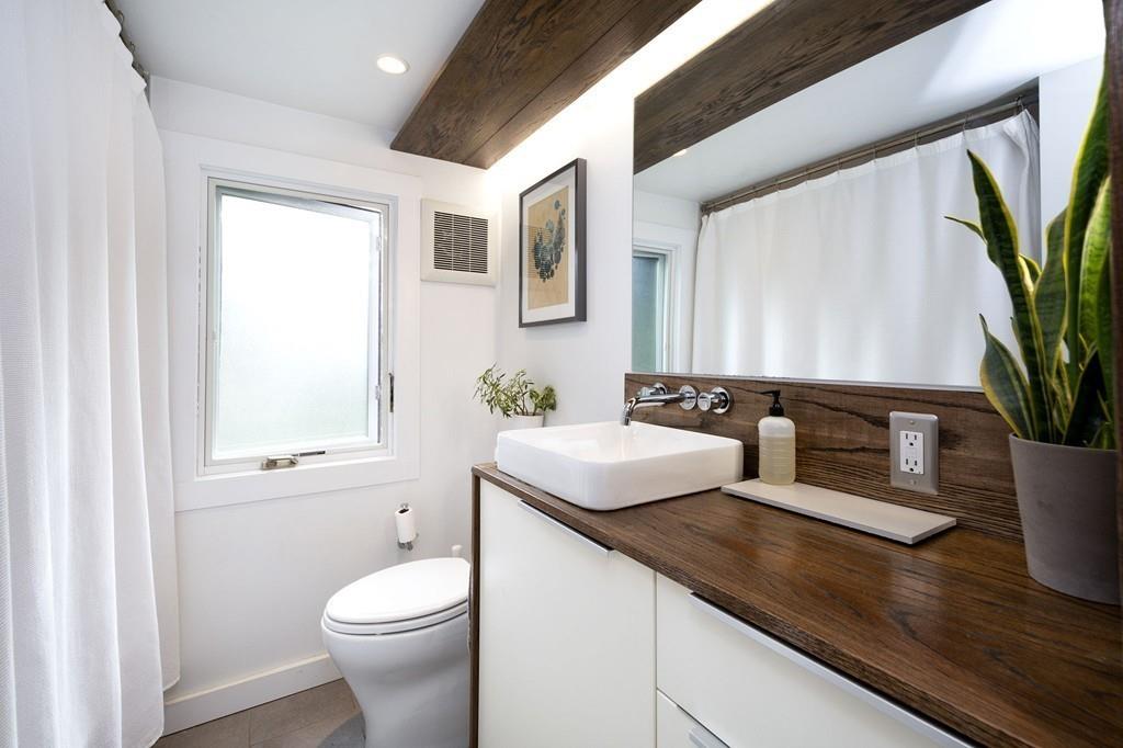 6 Turner Road Scituate, MA 02066 - Photo 14 of 28 a bathroom with a sink a toilet and a mirror