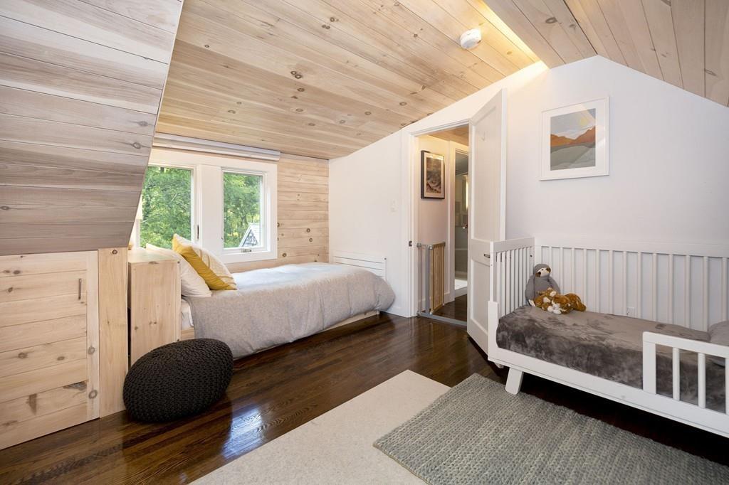 6 Turner Road Scituate, MA 02066 - Photo 19 of 28 a bedroom with a bed and wooden floor
