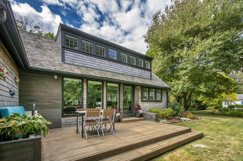 6 Turner Road Scituate, MA 02066 - Photo 26 of 28 a view of a patio with table and chairs and wooden fence