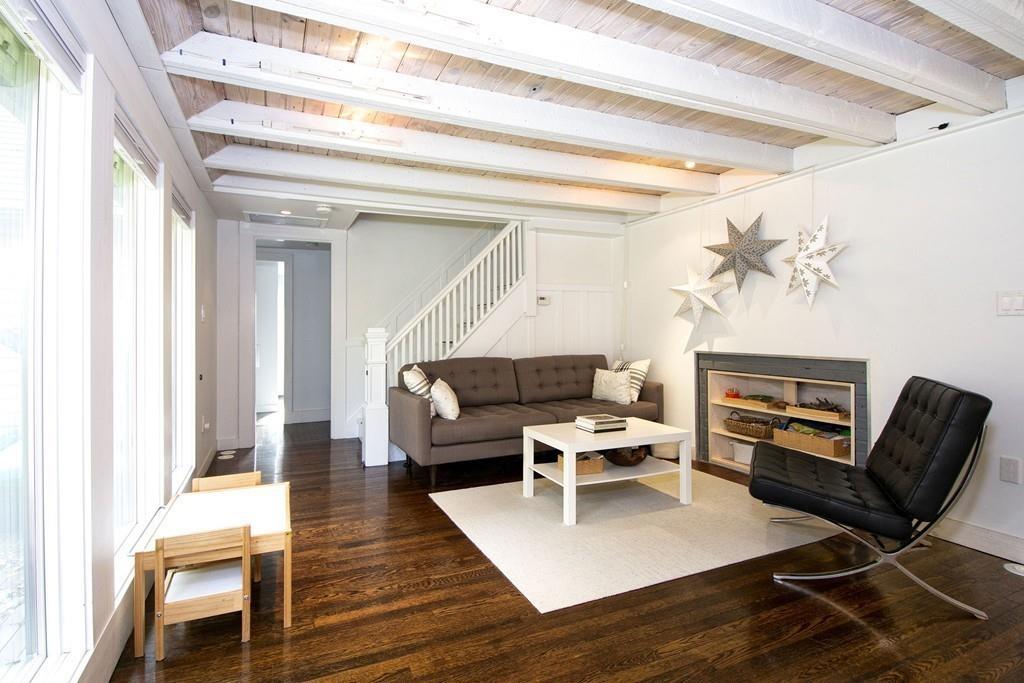 6 Turner Road Scituate, MA 02066 - Photo 10 of 28 a living room with fireplace furniture and a wooden floor
