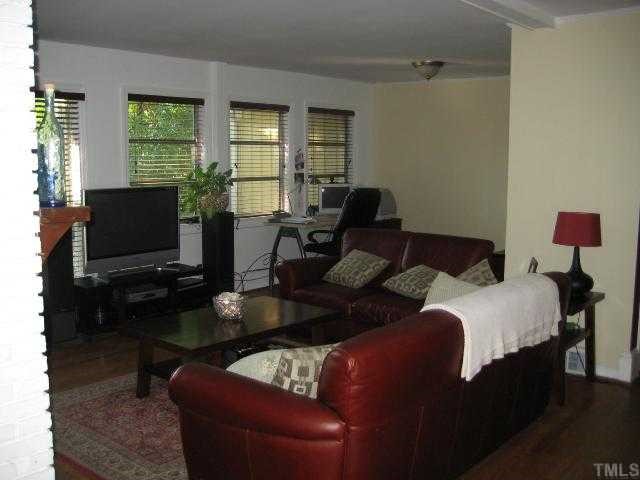 809 Graham Street Raleigh, NC 27605 - Photo 3 of 10 a living room with furniture and a flat screen tv