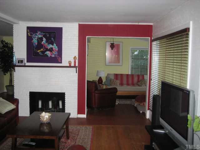 809 Graham Street Raleigh, NC 27605 - Photo 4 of 10 a living room with furniture and a fireplace