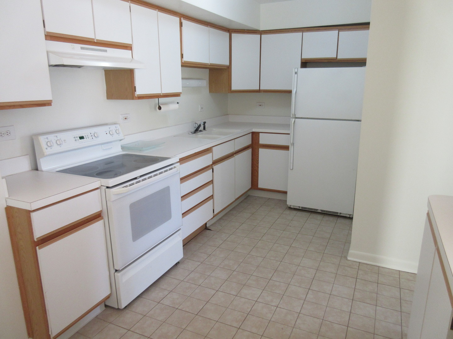 2214 South Goebbert Road, Unit 382 Arlington Heights, IL 60005 - Photo 3 of 9 a utility room with cabinets washer and dryer