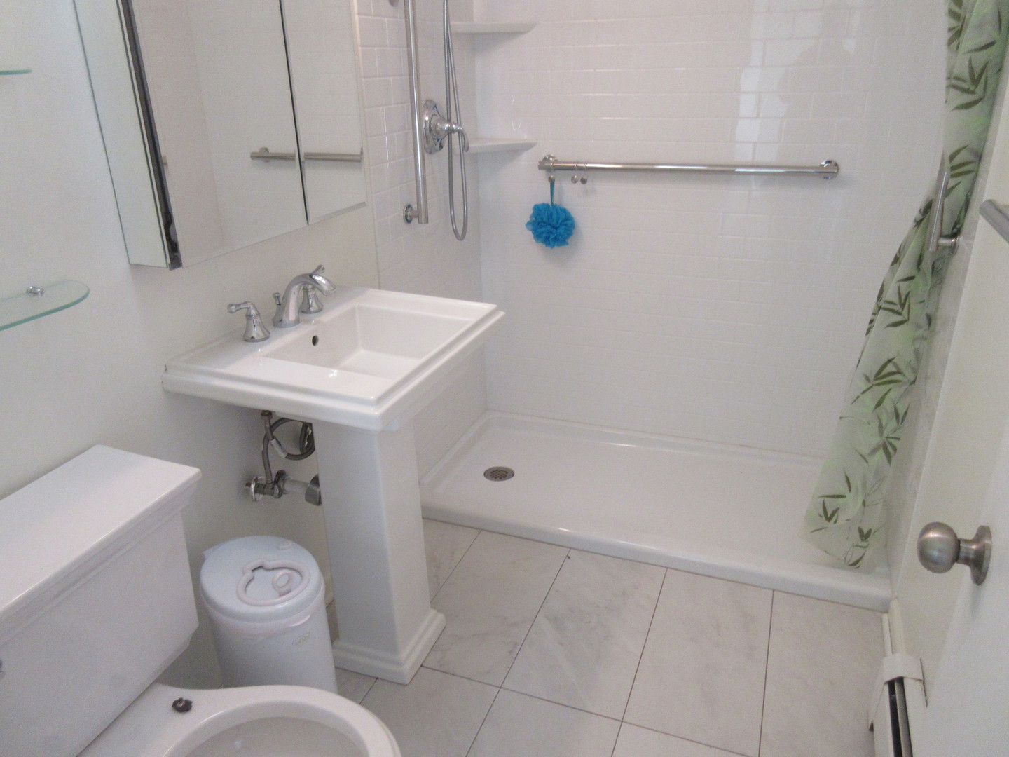 2214 South Goebbert Road, Unit 382 Arlington Heights, IL 60005 - Photo 8 of 9 a bathroom with a toilet sink and shower