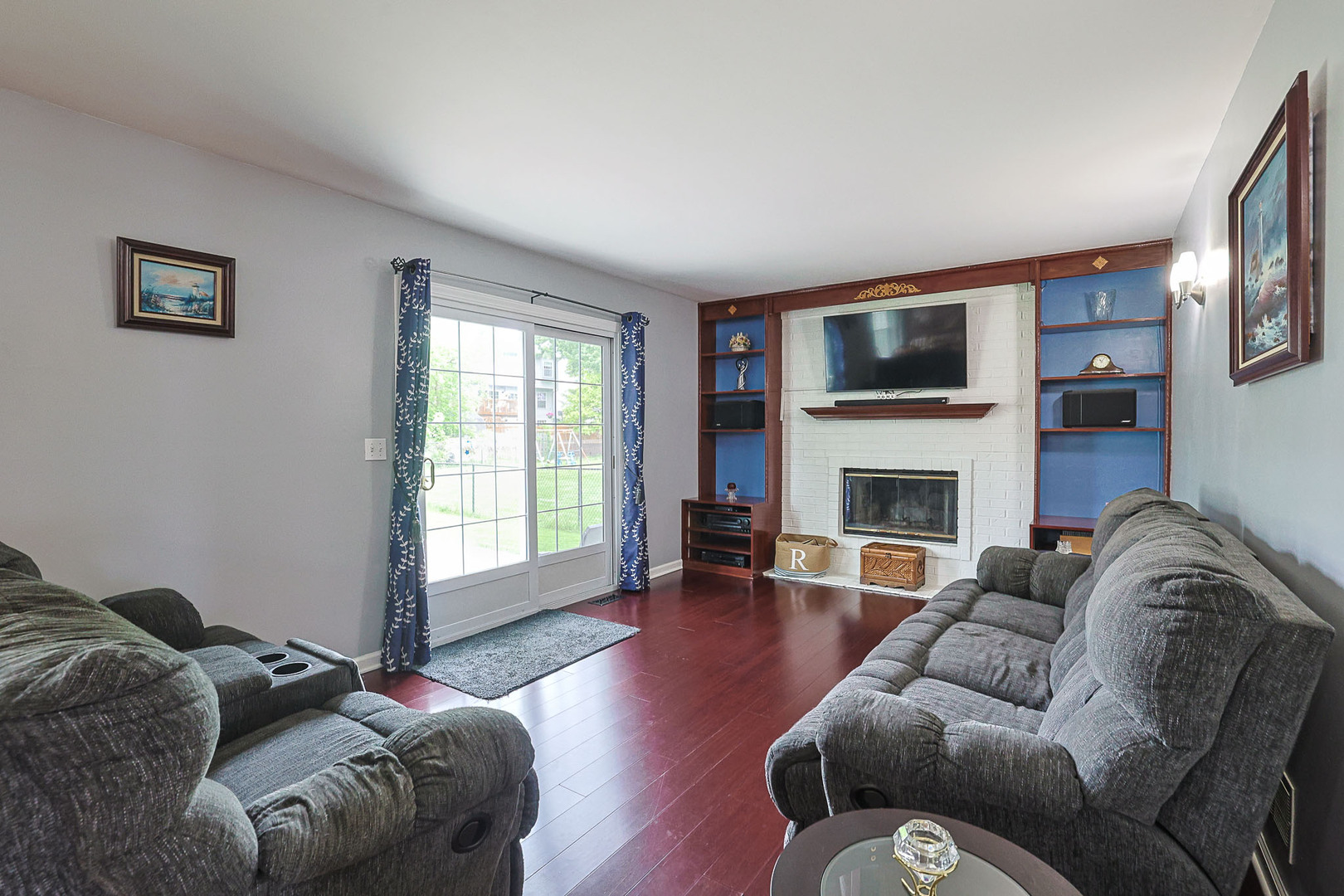 830 Hawk Lane Carol Stream, IL 60188 - Photo 10 of 30 a living room with furniture or fireplace and a flat screen tv