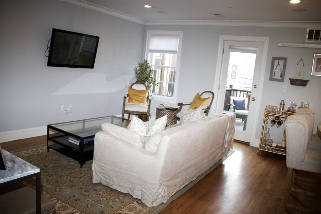 47 Soley Street, Unit 2 Boston, MA 02129 - Photo 11 of 23 a living room with furniture and a flat screen tv