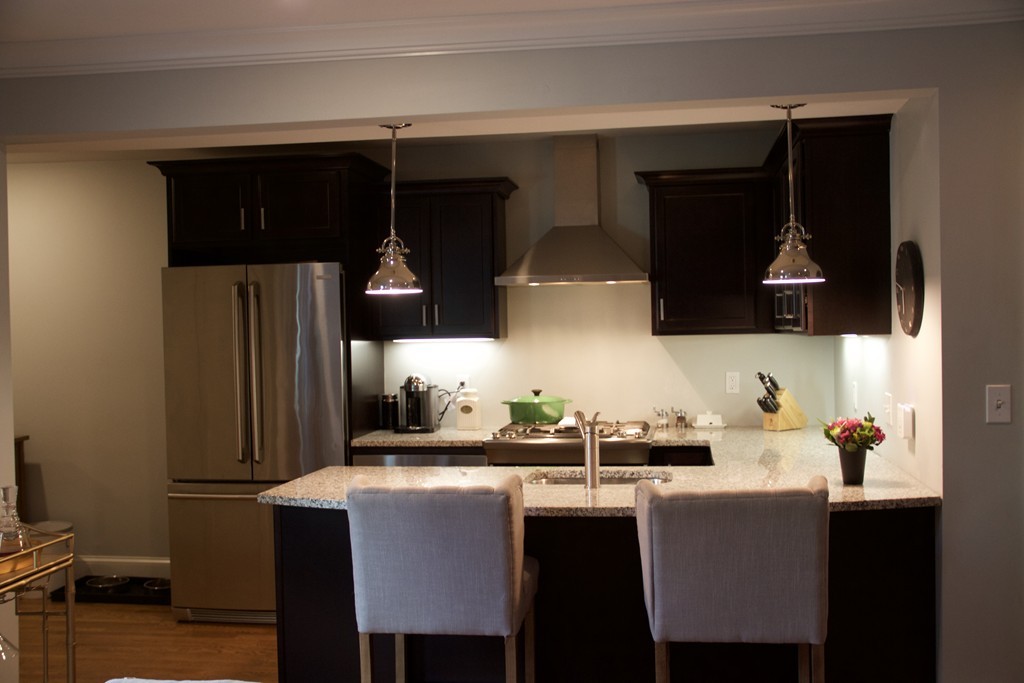 47 Soley Street, Unit 2 Boston, MA 02129 - Photo 3 of 23 a kitchen with stainless steel appliances a sink cabinets and a refrigerator