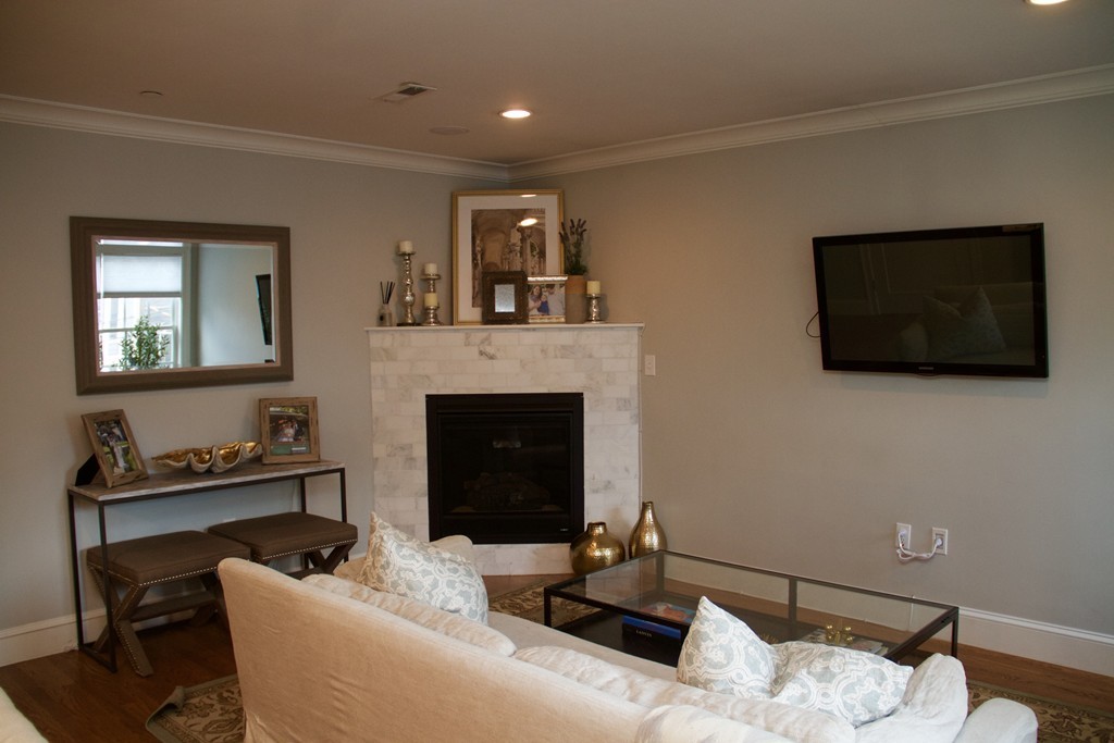 47 Soley Street, Unit 2 Boston, MA 02129 - Photo 10 of 23 a living room with furniture and a fireplace