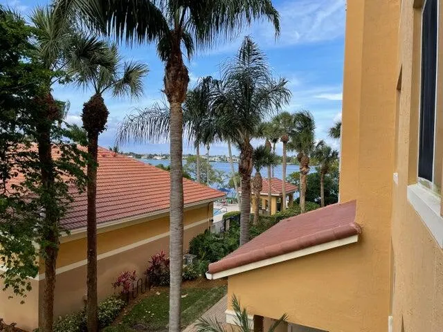 a view of a chairs and table in the balcony