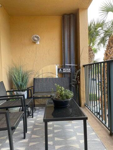 1200 Scotia Drive, Unit 305 Hypoluxo, FL 33462 - Photo 15 of 28 a view of a chairs and table in the balcony