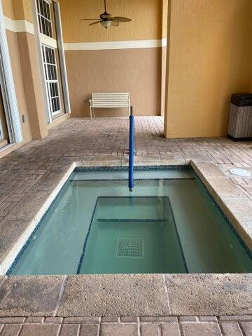1200 Scotia Drive, Unit 305 Hypoluxo, FL 33462 - Photo 18 of 28 a kitchen with a sink a counter top space and cabinets