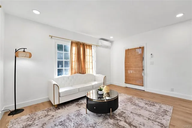 a living room with a couch and a window