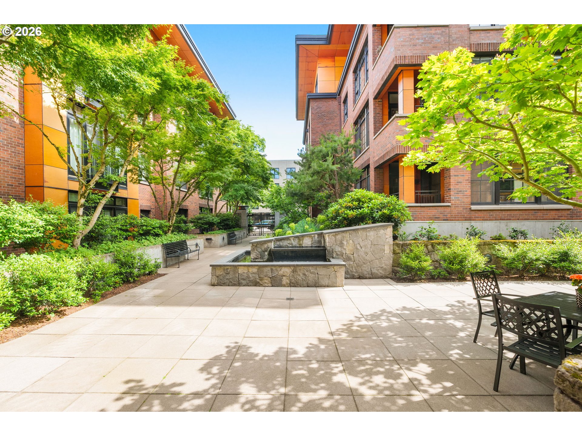 2350 Northwest Savier Street, Unit 224 Portland, OR 97210 - Photo 18 of 19 a view of a patio with couches and table and chairs and potted plants