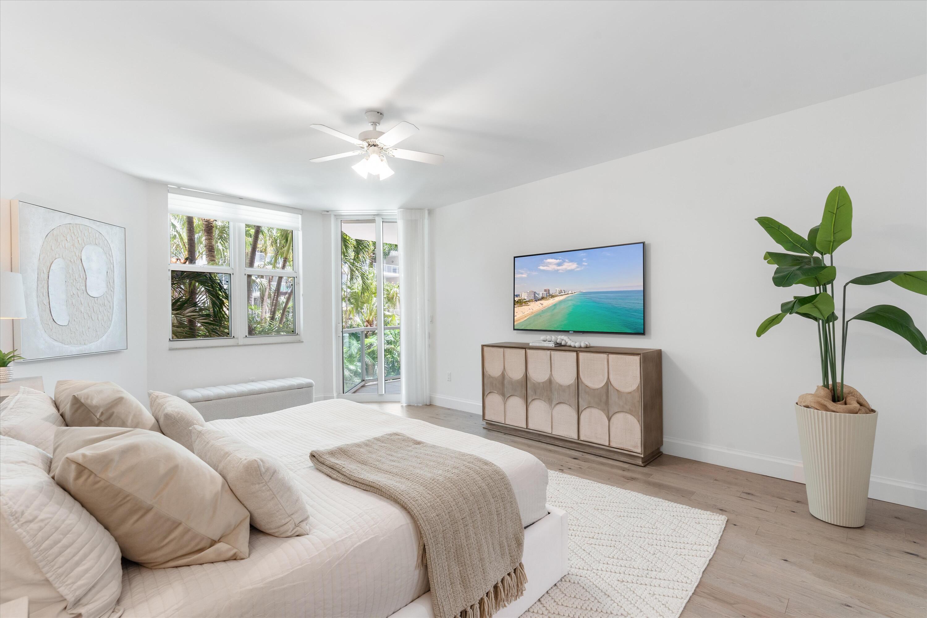 500 Southeast Mizner Boulevard, Unit A202 Boca Raton, FL 33432 - Photo 11 of 37 a bedroom with a bed and a window