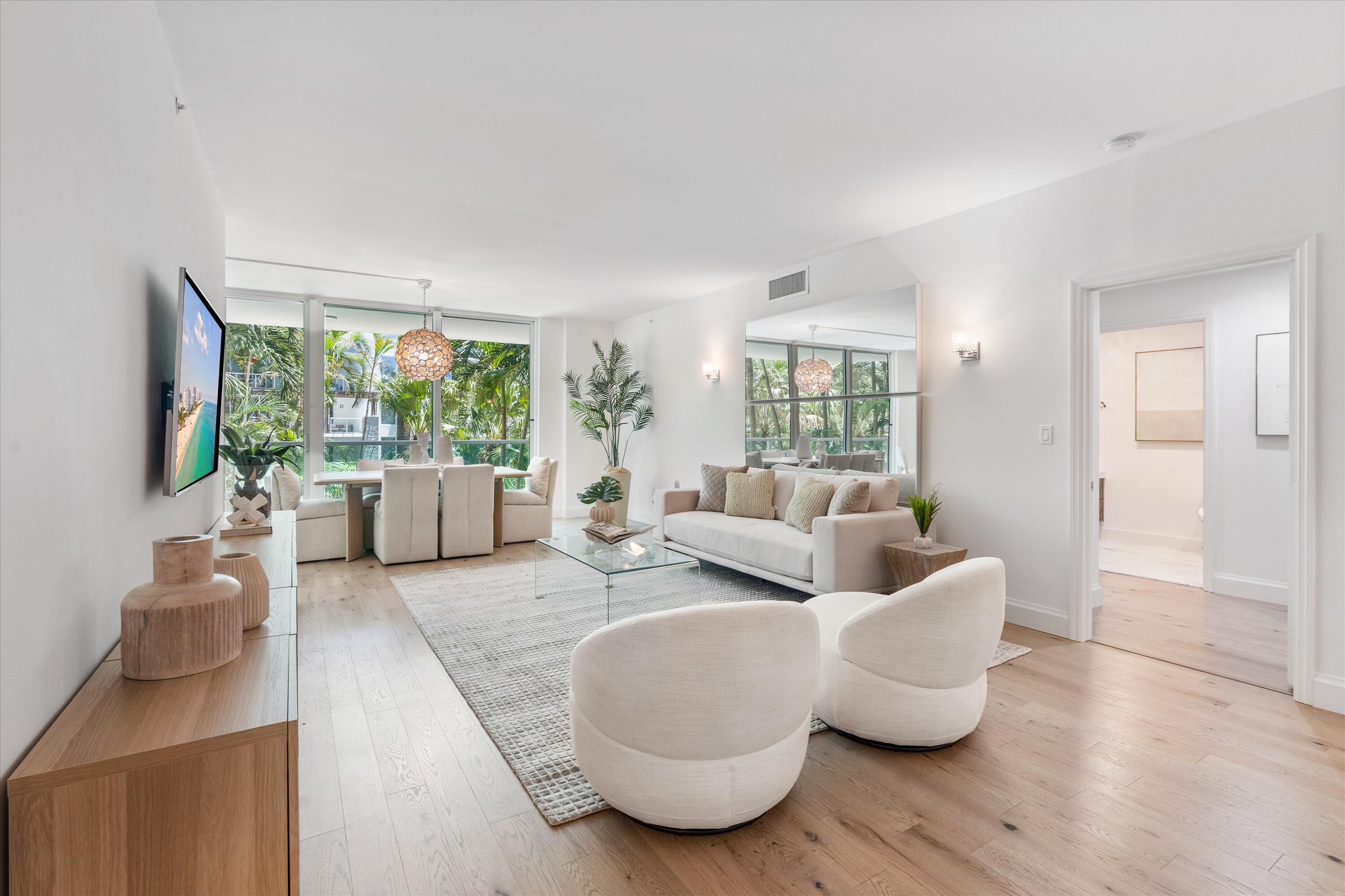 500 Southeast Mizner Boulevard, Unit A202 Boca Raton, FL 33432 - Photo 2 of 37 a living room with furniture and a large window