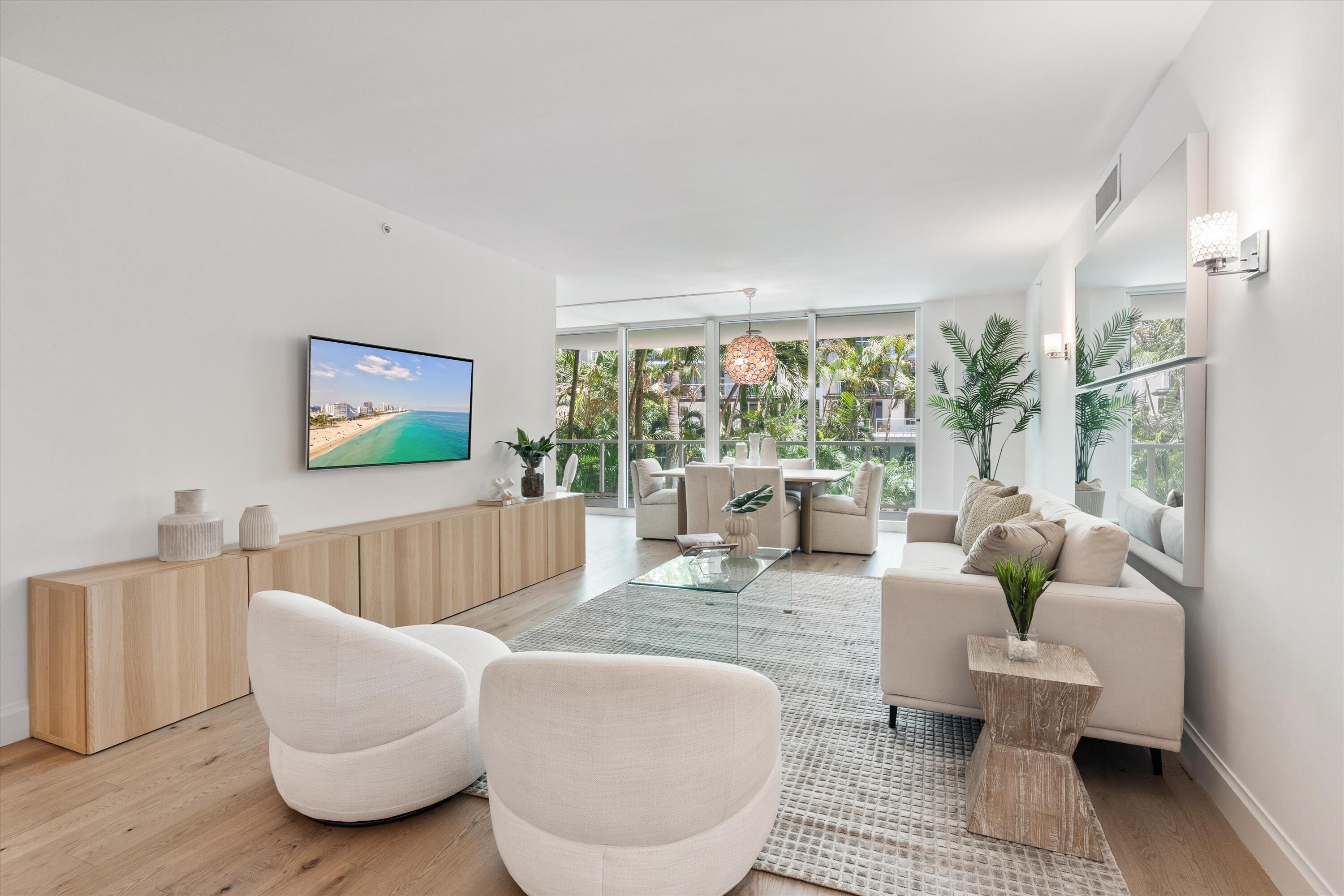 500 Southeast Mizner Boulevard, Unit A202 Boca Raton, FL 33432 - Photo 3 of 37 a living room with furniture and a large window