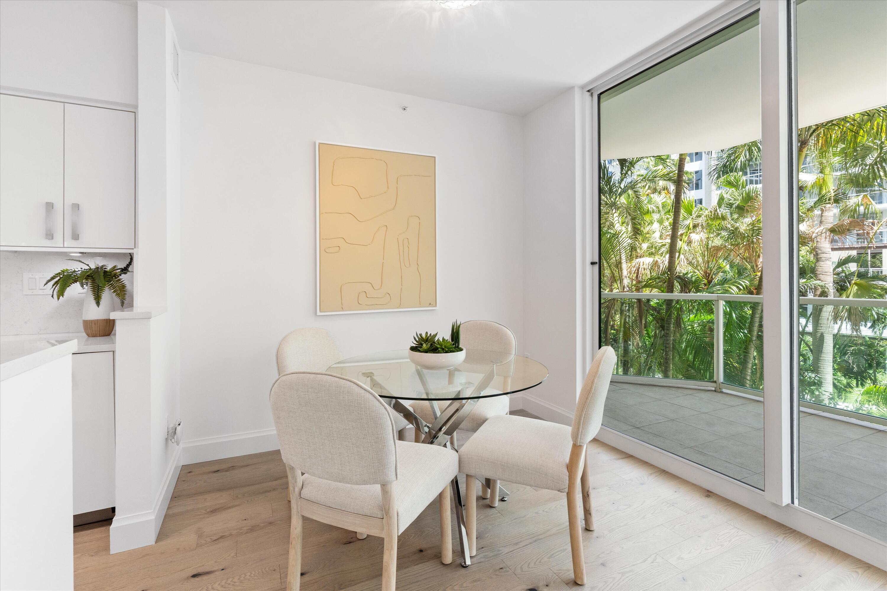 500 Southeast Mizner Boulevard, Unit A202 Boca Raton, FL 33432 - Photo 7 of 37 a view of a dining room with furniture window and outside view