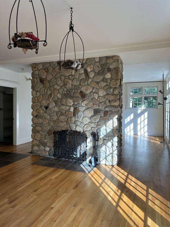 99 Tower Road Lincoln, MA 01773 - Photo 13 of 42 a view of a fireplace with a chandelier