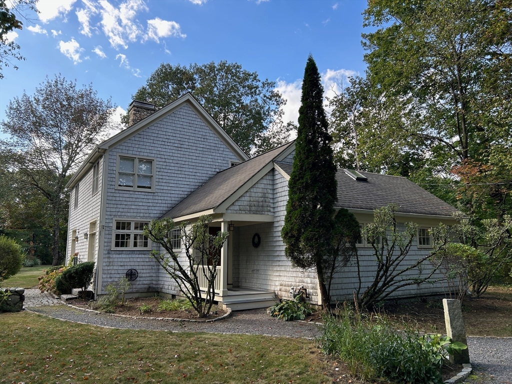 99 Tower Road Lincoln, MA 01773 - Photo 2 of 42 a front view of a house with garden