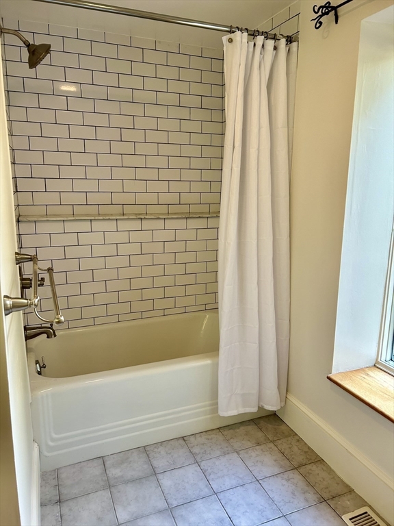 99 Tower Road Lincoln, MA 01773 - Photo 23 of 42 a bathroom with a bathtub and a shower